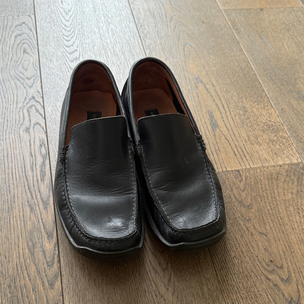 Men’s black slip on’s.